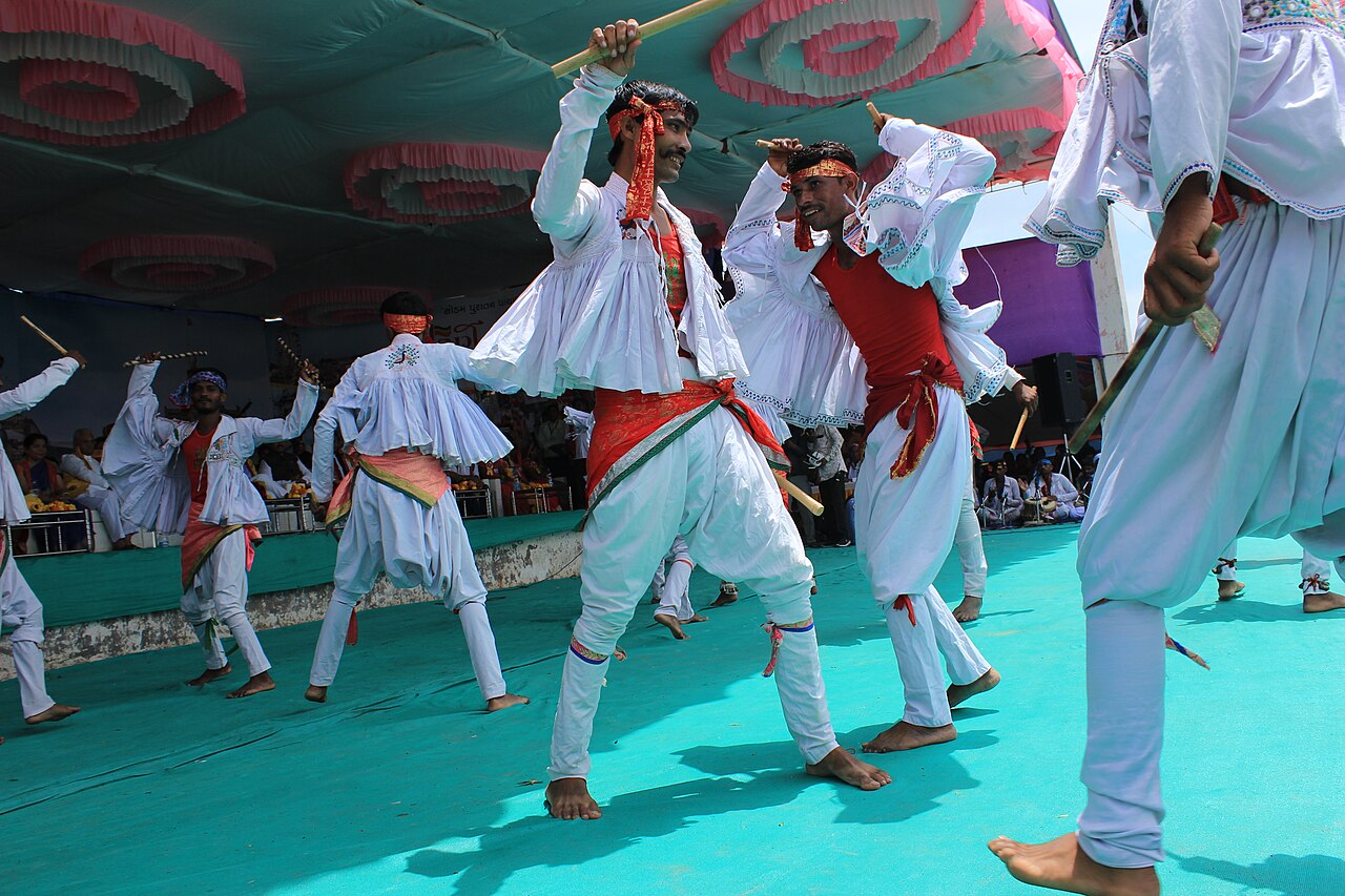 Dancers take up the sticks for the raas