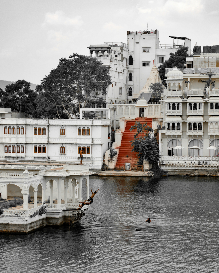 When the water is high, the children of Udaipur treat the lake as one enormous swimming pool. This is the city at its most off-guard, the version the tour boats glide straight past.