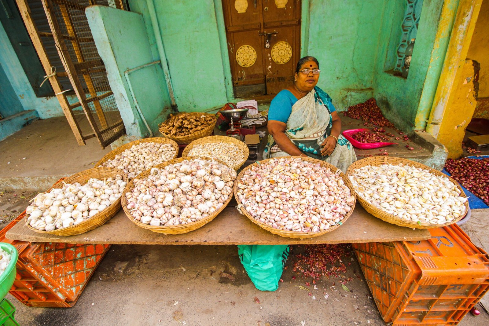A local market stall with vegetables sorted into baskets, the source behind everyday Indian food