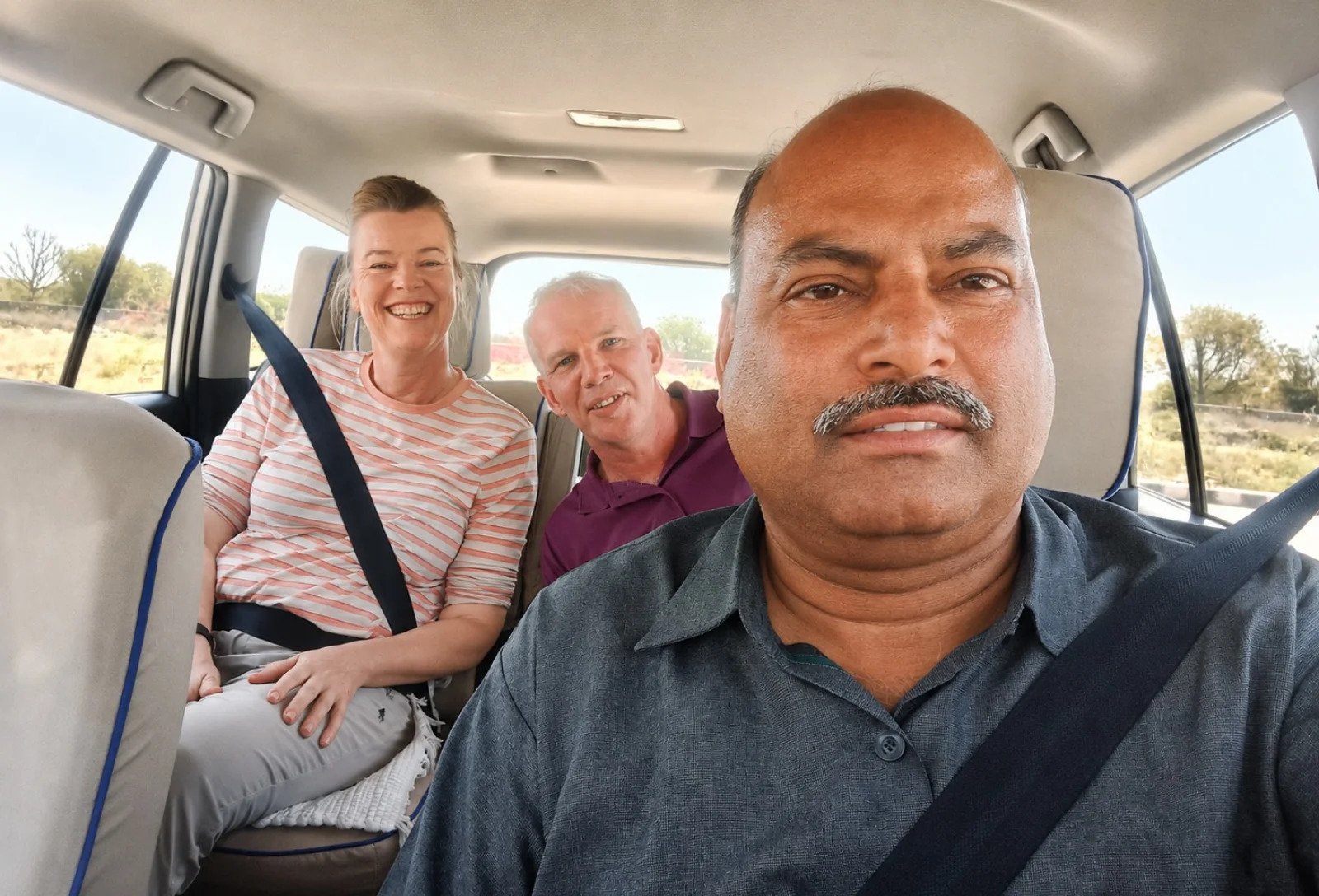 India tour driver taking a selfie, the personal side of travelling in India with Immerse India Tours