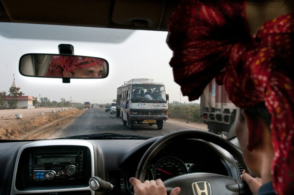 A guest and driver together on an India tour, the partnership at the heart of travelling in India with Immerse India Tours